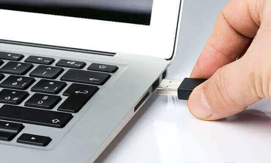 Plug your flash drive into the PC